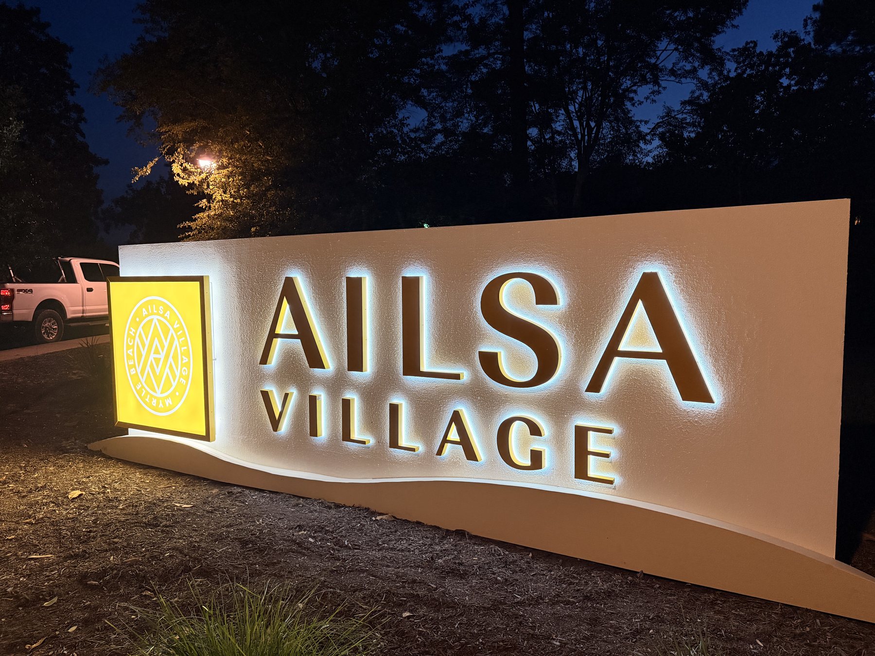 Illuminated Ailsa Village monument sign installed by Grand Strand Visuals in Myrtle Beach, South Carolina