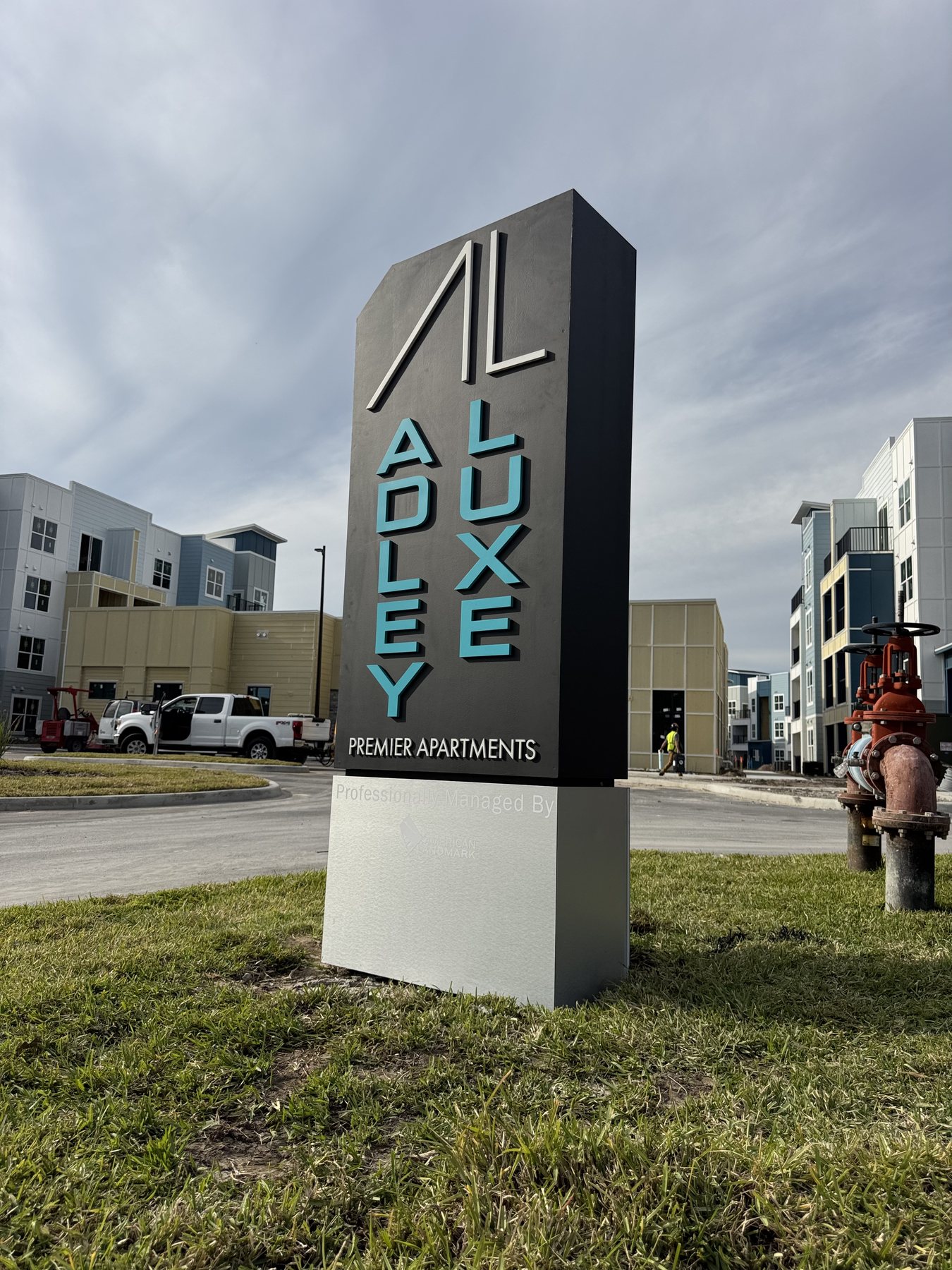Completed Alexan monument sign outside an apartment community