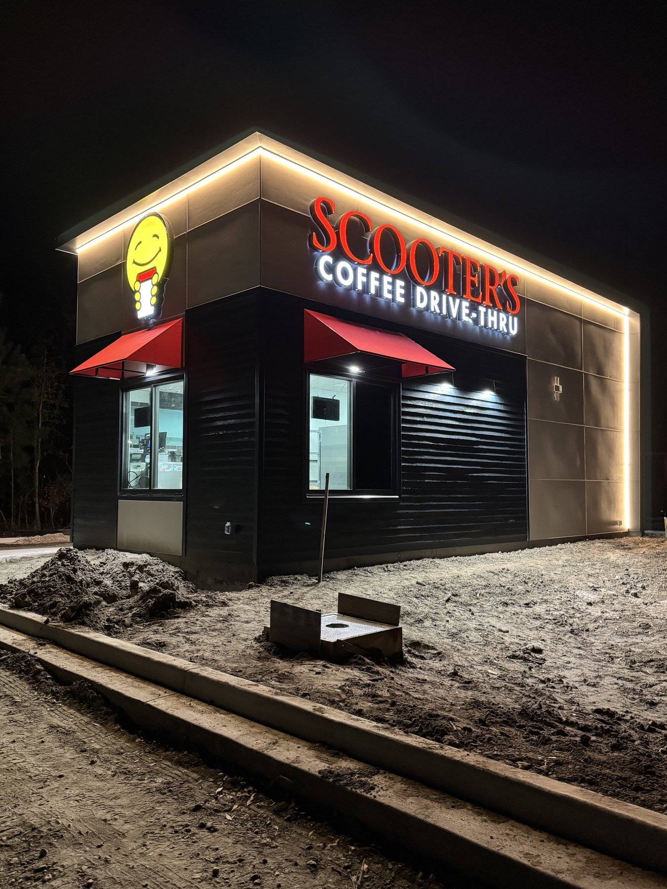 Scooter's Coffee Drive-Thru illuminated channel letter sign at night